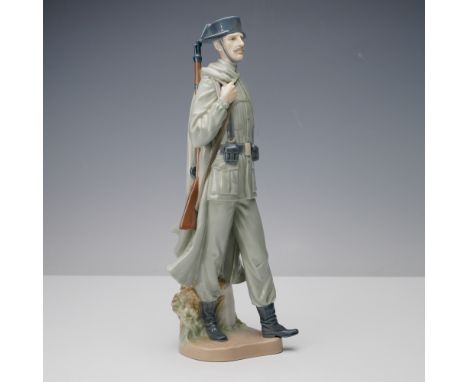 Depicting a proud Spanish policeman in full uniform, this porcelain figurine by Lladro captures the poised authority and char