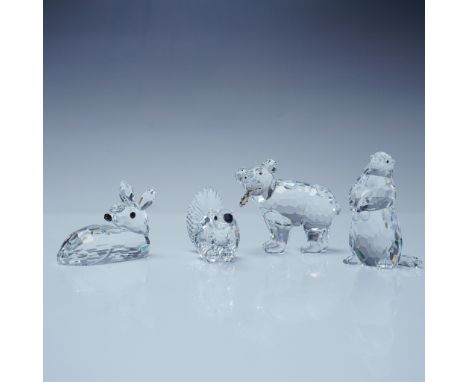 A charming collection of Swarovski crystal animal figurines, each showcasing the brand's renowned precision-cut craftsmanship