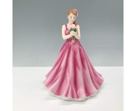 This Royal Doulton Flower of the Month series figurine, titled May Peony, features a young woman in a flowing pink gown holdi