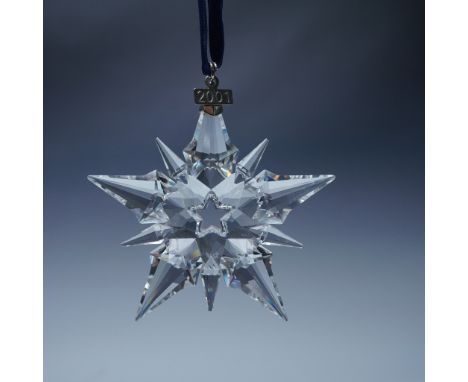 This Swarovski 2001 Annual Edition Christmas Ornament is a dazzling holiday collectible crafted from precision-cut crystal. T