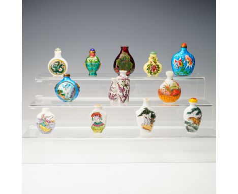 A vibrant collection of twelve Chinese snuff bottles, each showcasing unique designs, techniques, and motifs. The assortment 