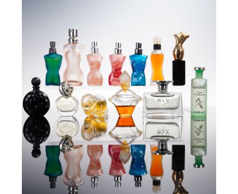 Assorted group of miniature perfume bottles in various shapes and colors. Highlights include sculptural forms with frosted an