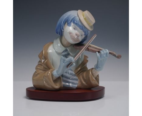 Charming and expressive Lladro porcelain sculpture titled The Blues, depicting a whimsical clown with blue hair and gloves pl