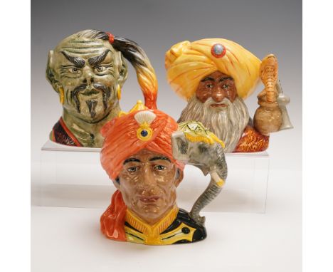 A vibrant trio of Royal Doulton character jugs featuring distinctive figures: The Elephant Trainer D6841, The Genie D6892, an