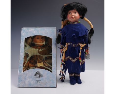 Set of two collectible porcelain dolls in original boxes. Includes Swan from the Traditions Doll Collection, dressed in a fau