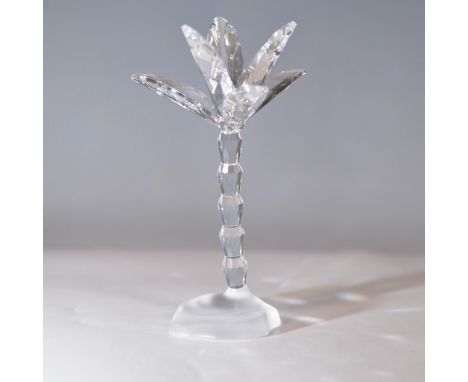 This elegant Swarovski crystal figurine depicts a palm tree, part of the "In the Secret Garden" collection. Designed by Micha