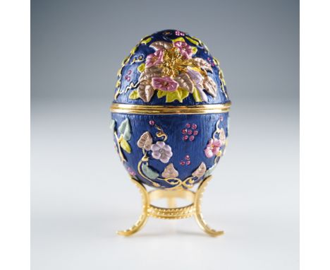 Charming Faberge-style egg-shaped treasure box by Ruccini, featuring a hinged lid and intricate floral motif in raised enamel