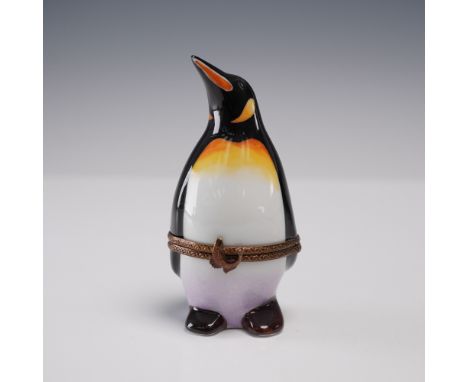 Hand-painted in Limoges, France, this porcelain box takes the whimsical form of a standing penguin with striking black, white