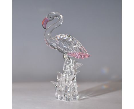 Elegant Swarovski crystal figurine depicting a flamingo with delicate pink accents on its beak and tail, standing gracefully 