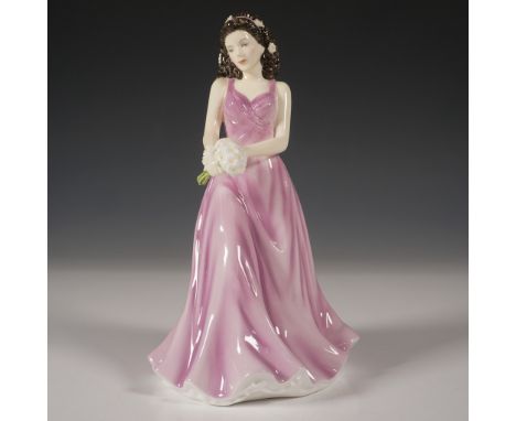 This exquisite Royal Doulton figurine, April Daisy Innocence (HN5503), is part of the Flower of the Month collection. Crafted
