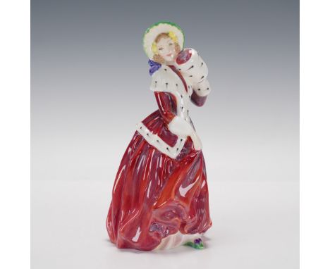 Glazed porcelain figure of a lady in a red skirt and coat with white trim and muff. Green hat with purple ribbon. Royal Doult