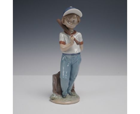 Charming Lladro porcelain figurine featuring a young boy with a baseball bat resting on his shoulder, ready for the game. He 