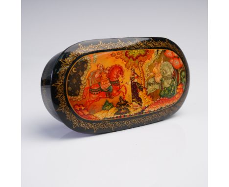 This Russian lacquer box is crafted in a graceful oval form, featuring an exquisitely painted scene from the beloved folktale