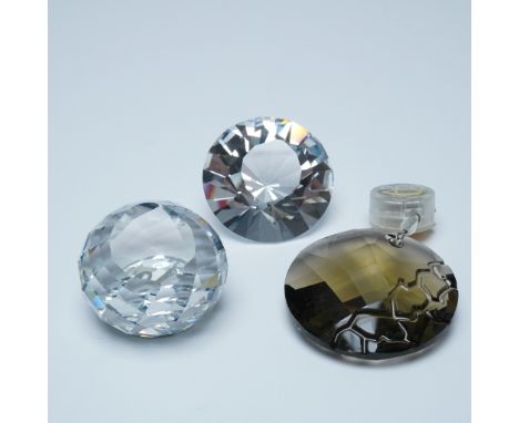 A dazzling collection of Swarovski SCS crystal pieces, including faceted chaton, Swan paperweight and crystal window ornament