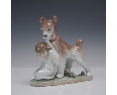 Charming Lladro porcelain figurine titled Safe and Sound (model 1006556), sculpted by Juan Huerta. Issued in 1998 as the "Eve