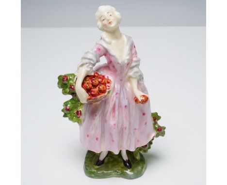 This Royal Doulton porcelain figurine, titled Masquerade and numbered HN600, presents an elegantly posed woman in a flowing p