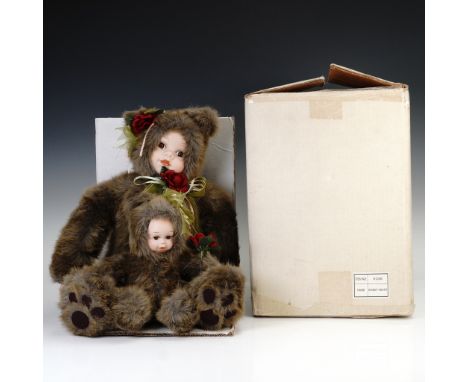 From the Traditions Doll Collection, this charming "Sweet Heart" set features a pair of porcelain dolls dressed in coordinati