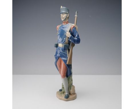 This Lladro porcelain figurine titled Spanish Soldier (01005255) is a vivid portrayal of a uniformed military figure, sculpte