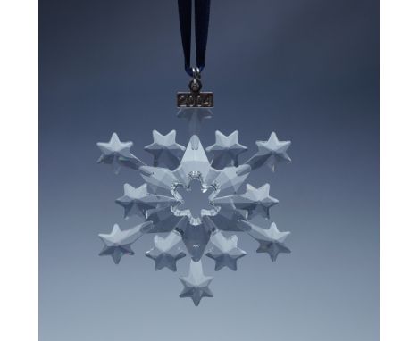 An addition to Swarovski's annual Christmas ornament series, this 2004 edition features an intricate snowflake design with tw