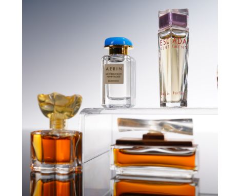 Collection of nine miniature perfume bottles from various designer brands, including Amarige by Givenchy, Honeysuckle by Aeri