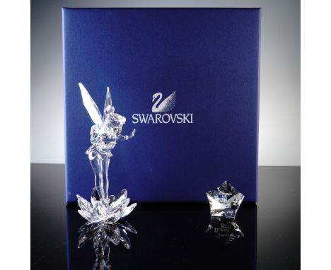 This sparkling Swarovski crystal figurine captures Disney's beloved Tinker Bell in brilliant clear crystal with vibrant Auror