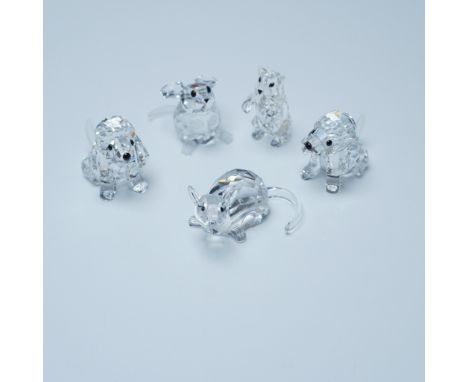A charming collection of Swarovski crystal animal figurines, each meticulously crafted with precision-cut facets to enhance b
