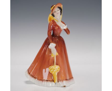Part of the Peggy Davies Classics collection. Depicts a woman modeled in an orange dress. Royal Doulton backstamp. Artist: Pe