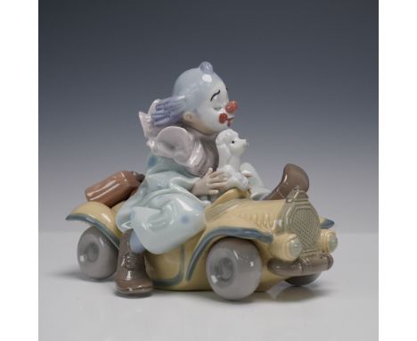 A delightful and whimsical porcelain figurine from the Lladro Privilege Collection titled Trip to the Circus (01008136), desi
