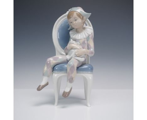 Glazed Lladro porcelain figurine titled Young Harlequin (model 1001229), sculpted by Fulgencio Garcia and issued in 1972. Thi