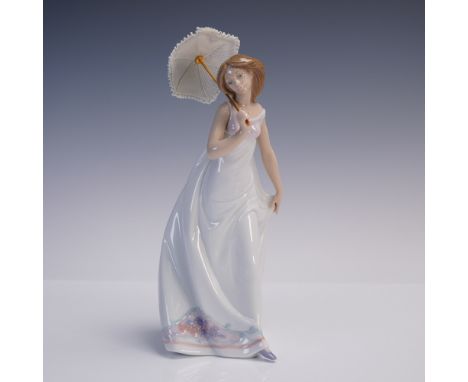 Elegant Lladro porcelain figurine titled Afternoon Promenade (Spanish name Bajo El Sol de Primavera), sculpted by Jose Puche.