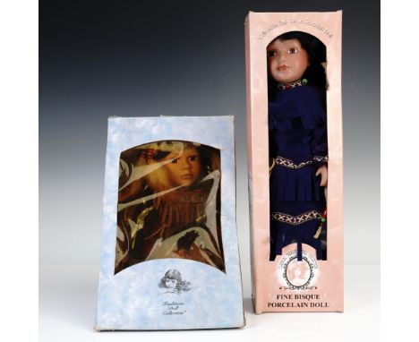 Set of two collectible porcelain dolls in original boxes. Includes Swan from the Traditions Doll Collection, dressed in a fau