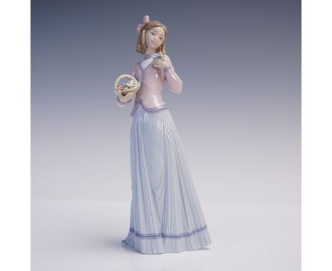 Lladro porcelain figurine titled Innocence in Bloom, model number 1007644. Sculpted by Jose Puche and issued in 1996 exclusiv