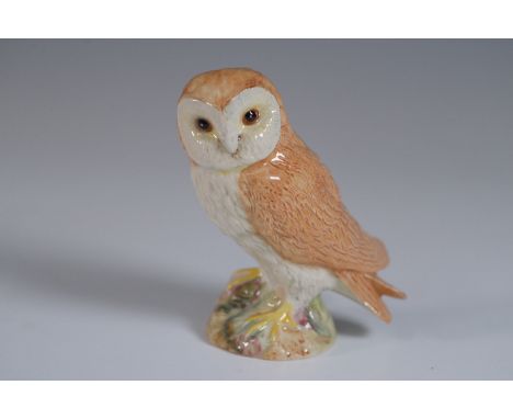 Charming Beswick porcelain figurine of a barn owl, meticulously hand-painted in naturalistic hues of brown, white, and yellow