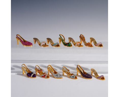 A stylish collection of 13 miniature high heel shoe figurines by Rucinni, each finished in gold tone with jeweled or enameled