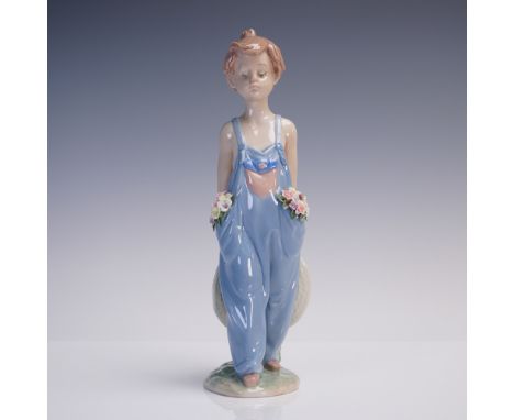 Charming Lladro porcelain figurine titled Pocket Full of Wishes, model 1007650, designed by sculptor Antonio Ramos and issued