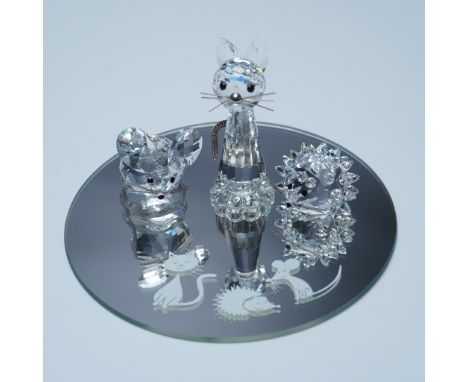 This retired Swarovski crystal starter set was part of the 'When We Were Young' collection. It includes a mouse, cat, and hed