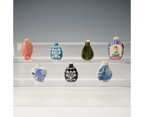 A group of seven miniature snuff bottles each showcasing a distinct form material and decorative technique. The collection in