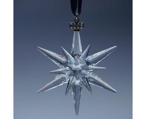 A tribute to Swarovski's craftsmanship, this 2005 annual Christmas ornament showcases a striking twelve-point star design, fe