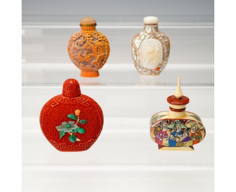 A vibrant and varied quartet of Asian snuff bottles, each crafted in a distinct style that showcases a range of decorative tr