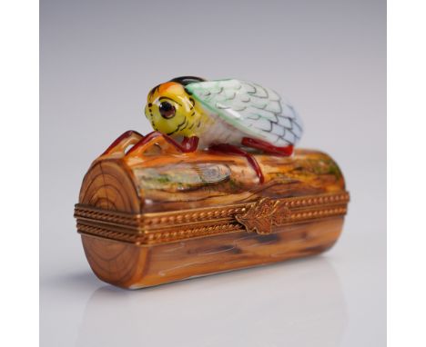 Hand-painted Limoges porcelain trinket box depicting a vividly detailed cicada resting atop a log, featuring lifelike texture