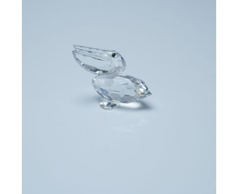 This Swarovski Silver Crystal Pelican Bird figurine is crafted from precision-cut clear crystal, showcasing a faceted body an
