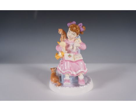 This Royal Doulton figurine from the Childhood Memories collection, titled Bedtime Story (CH8), depicts a young girl reading 