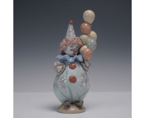 Charming Lladro porcelain figurine titled Littlest Clown, model number 1005811. Sculpted by Antonio Ramos and issued in 1991,