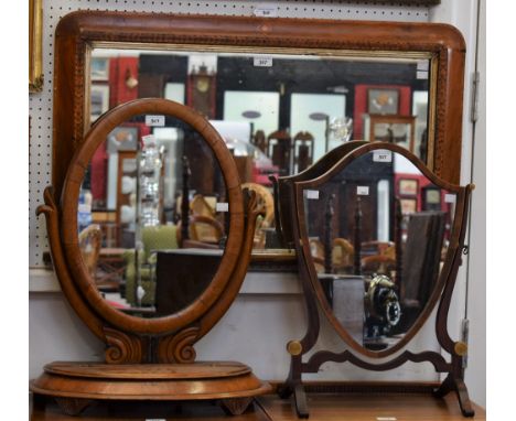 A Victorian mahogany dressing mirror; another, shield shaped; a parquetry wall mirror (3)