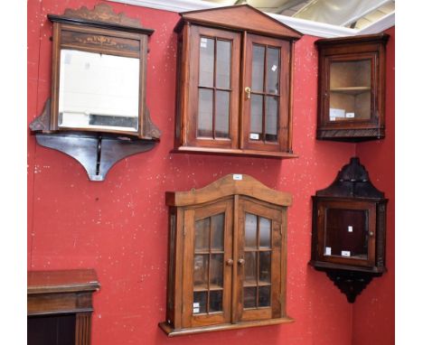 A marquetry wall mirror, bevelled square plate crested by a shaped panel inlaid with an urn flanked by scrolling foliage; a w