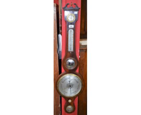 A late 19th/early 20th century mahogany barometer, swan neck pediment centred by an urnular finial, bears label for M Phillip