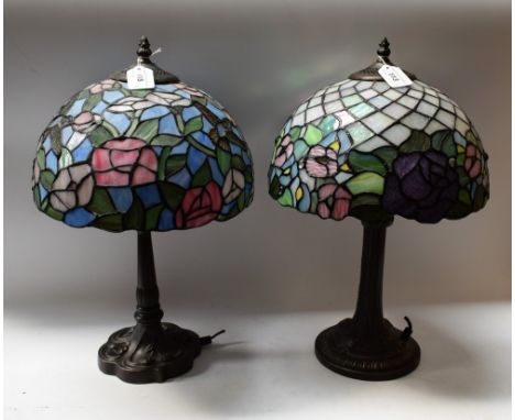 A Tiffany style lamp, leaded glass shade, floral design in tones of mother of pearl, yellow, pink, mauve, blue and green; ano