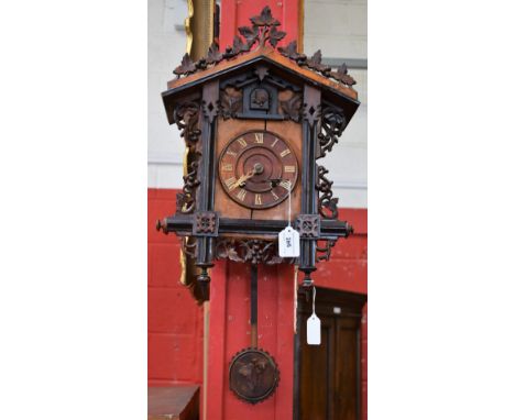 A late 19th/early 20th century Cuckoo clock, German eight day movement, carved pendulum Condition Report: Please see addition