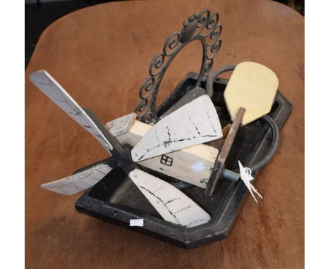 An early 20th century Folk Art weather vane, as a man turning a windmill, painted finish; a cast stick holder Condition Repor