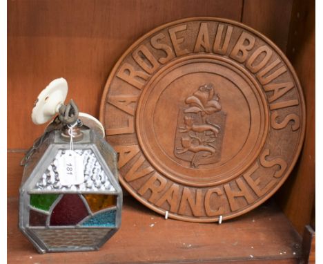 An early 20th century lead and stained glass ceiling lamp; a French carved treen souvenir dish, Avranches, La Rose Aubouais (